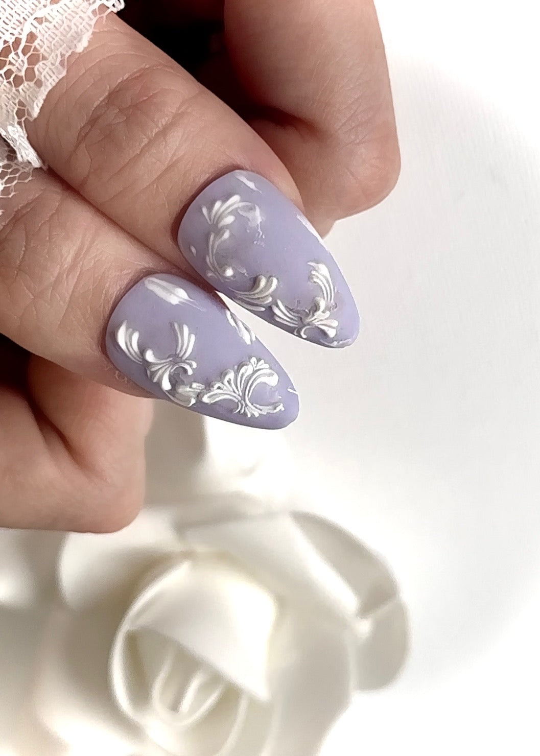 Close-up view of Victorian Wedgeware press-on nails featuring classic and elegant design