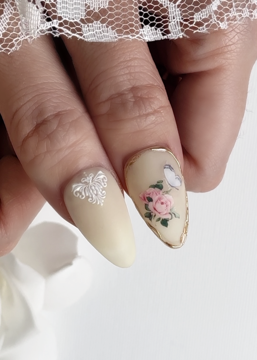 Close-up view of English Rose Garden-Koreana Bloom press-on nails featuring elegant and classic design with fresh floral details- Actual look for two thumbss