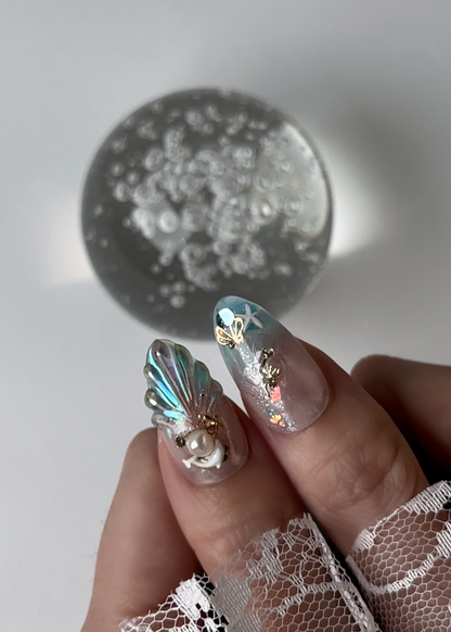 Close-up view of Little Mermaid press-on nails featuring elegant and classic design with a cool and fresh vibe