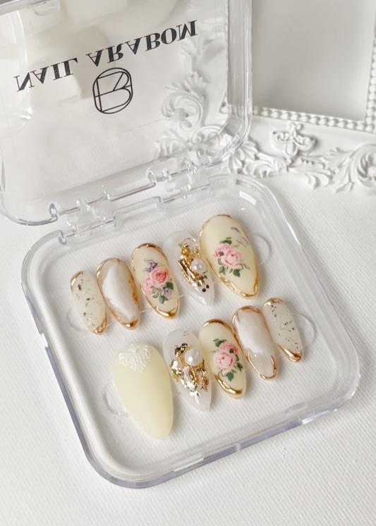 Close-up view of English Rose Garden-Koreana Bloom press-on nails featuring elegant and classic design with fresh floral details Front look with case